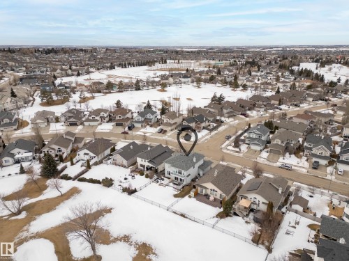 Snowy aerial view with a residential view - 19 Rosemount Boulevard, Beaumont, AB - Outdoor With View
