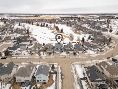 Snowy aerial view featuring a residential view - 19 Rosemount Boulevard, Beaumont, AB - Outdoor With View