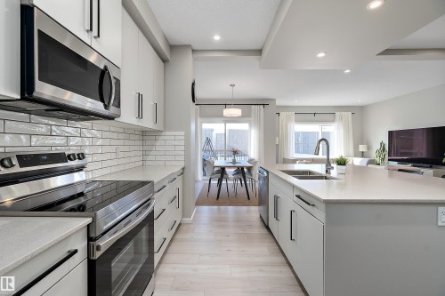 197 Larch Crescent, Leduc, AB - Indoor Photo Showing Kitchen With Double Sink With Upgraded Kitchen