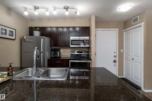 111 5370 Chappelle Road, Edmonton, AB - Indoor Photo Showing Kitchen With Stainless Steel Kitchen With Double Sink