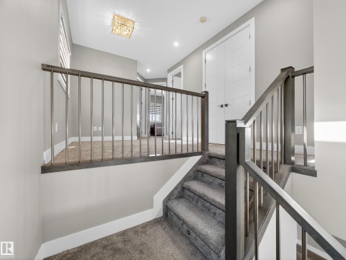 Stairs featuring carpet flooring and recessed lighting - 9358 Pear Link Link, Edmonton, AB - Indoor Photo Showing Other Room