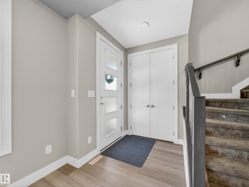 Entryway featuring light wood-type flooring and stairway - 9358 Pear Link Link, Edmonton, AB - Indoor Photo Showing Other Room