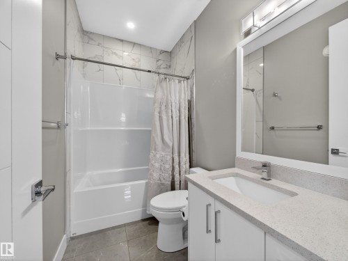 Full bath featuring vanity and shower / bath combination with curtain - 9358 Pear Link Link, Edmonton, AB - Indoor Photo Showing Bathroom