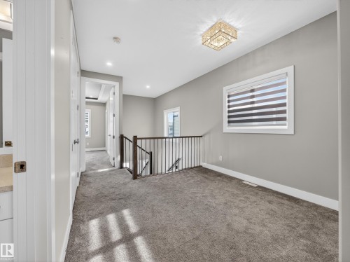 Unfurnished room featuring carpet floors and recessed lighting - 9358 Pear Link Link, Edmonton, AB - Indoor Photo Showing Other Room