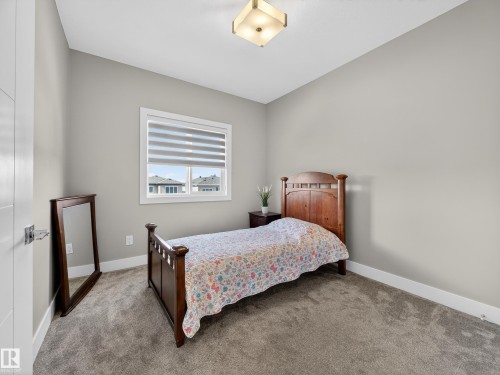 Carpeted bedroom featuring baseboards - 9358 Pear Link Link, Edmonton, AB - Indoor Photo Showing Bedroom