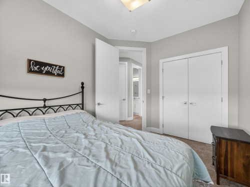 Bedroom with carpet floors and a closet - 9358 Pear Link Link, Edmonton, AB - Indoor Photo Showing Bedroom