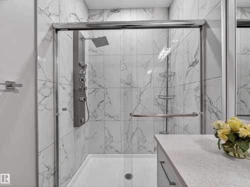 Bathroom with vanity and a marble finish shower - 9358 Pear Link Link, Edmonton, AB - Indoor Photo Showing Bathroom