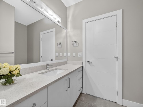 Bathroom featuring vanity and light tile patterned flooring - 9358 Pear Link Link, Edmonton, AB - Indoor Photo Showing Bathroom