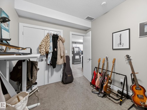 Exercise room with light colored carpet - 9358 Pear Link Link, Edmonton, AB - Indoor Photo Showing Other Room