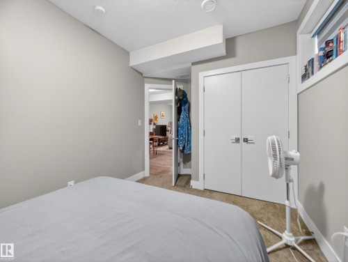 Bedroom featuring light carpet and a closet - 9358 Pear Link Link, Edmonton, AB - Indoor Photo Showing Bedroom
