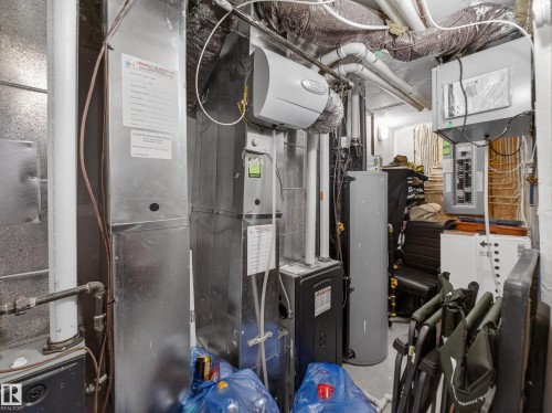 Utilities with electric panel and water heater - 9358 Pear Link Link, Edmonton, AB - Indoor Photo Showing Basement