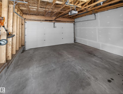 Garage with a garage door opener - 9358 Pear Link Link, Edmonton, AB - Indoor Photo Showing Garage