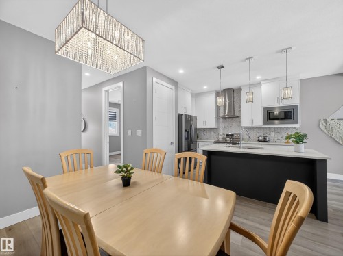 Dining area featuring light wood-type flooring and recessed lighting - 9358 Pear Link Link, Edmonton, AB - Indoor Photo Showing Dining Room