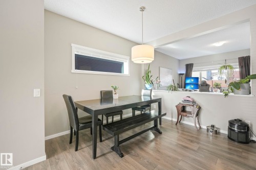 Dining room with wood finished floors and a textured ceiling - 97 James Cres, St. Albert, AB - Indoor Photo Showing Dining Room