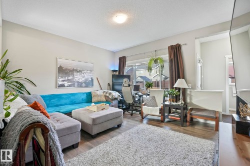 Living area with a textured ceiling and wood finished floors - 97 James Cres, St. Albert, AB - Indoor Photo Showing Living Room