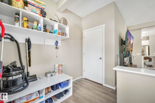 Mudroom featuring light wood-style flooring and baseboards - 97 James Cres, St. Albert, AB - Indoor