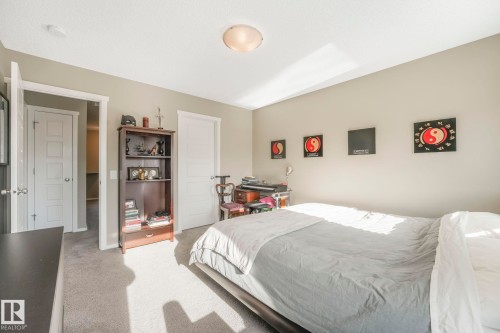 Bedroom featuring light colored carpet and baseboards - 97 James Cres, St. Albert, AB - Indoor Photo Showing Bedroom