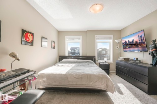 Bedroom with carpet and a textured ceiling - 97 James Cres, St. Albert, AB - Indoor Photo Showing Bedroom