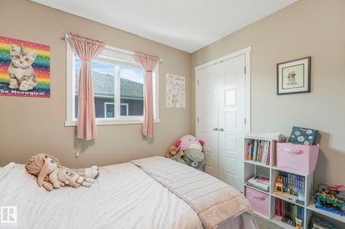 Carpeted bedroom with a closet and a textured ceiling - 97 James Cres, St. Albert, AB - Indoor Photo Showing Bedroom