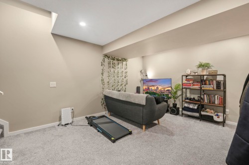 Living area with carpet flooring and recessed lighting - 97 James Cres, St. Albert, AB - Indoor