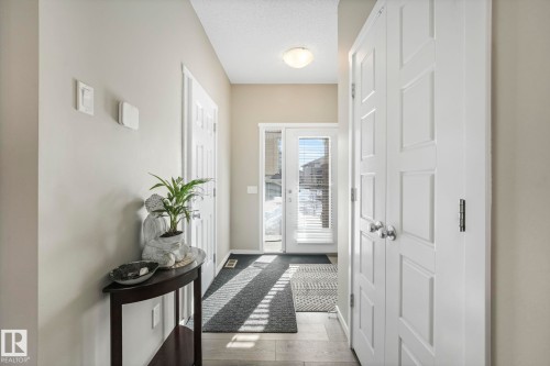 Doorway with hardwood / wood-style flooring and a textured ceiling - 97 James Cres, St. Albert, AB - Indoor Photo Showing Other Room