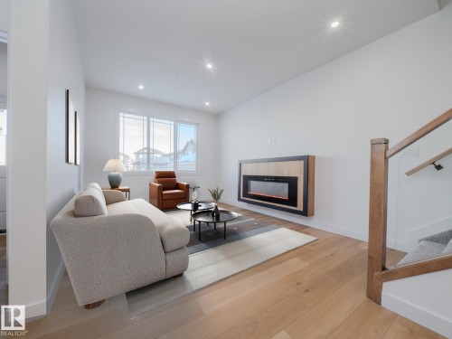 9824 106 Avenue, Morinville, AB - Indoor Photo Showing Living Room With Fireplace
