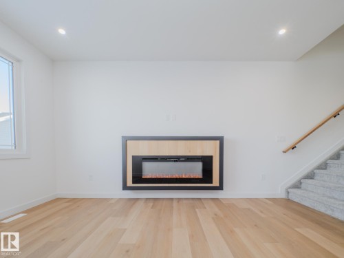 9824 106 Avenue, Morinville, AB - Indoor Photo Showing Living Room With Fireplace