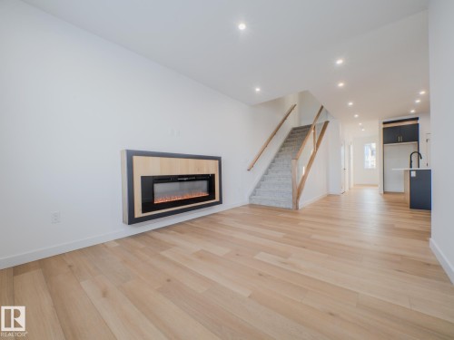 9824 106 Avenue, Morinville, AB - Indoor Photo Showing Living Room With Fireplace