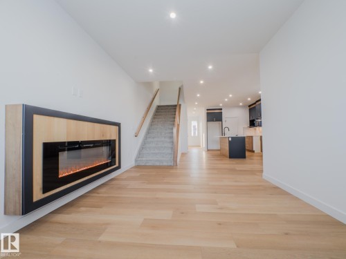 9824 106 Avenue, Morinville, AB - Indoor Photo Showing Living Room With Fireplace