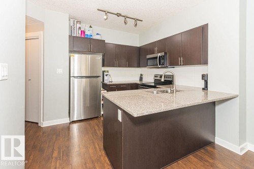 1404 10152 104 Street, Edmonton, AB - Indoor Photo Showing Kitchen With Stainless Steel Kitchen With Double Sink