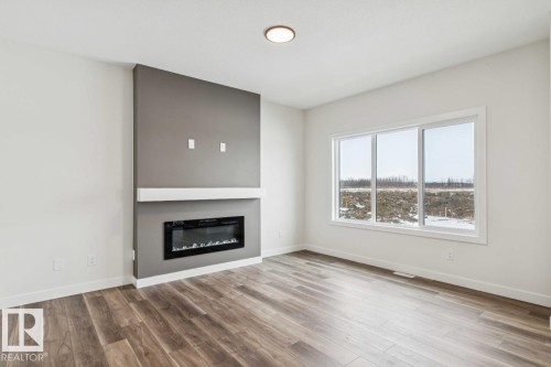 41 Gable Common, Spruce Grove, AB - Indoor Photo Showing Living Room With Fireplace