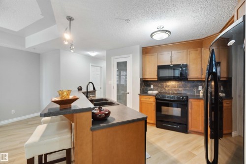 402 9020 Jasper Avenue, Edmonton, AB - Indoor Photo Showing Kitchen With Double Sink