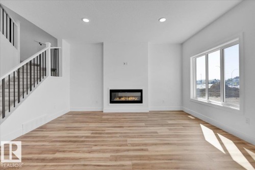 70 Sumac Close, Fort Saskatchewan, AB - Indoor Photo Showing Other Room With Fireplace