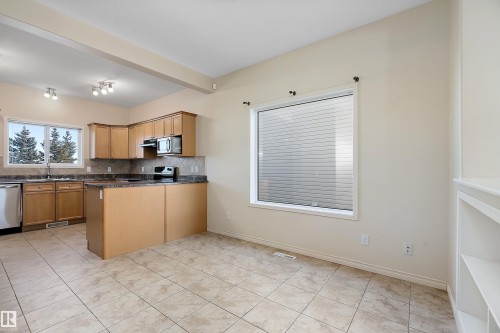 54 Birchglen Crescent, Leduc, AB - Indoor Photo Showing Kitchen With Double Sink