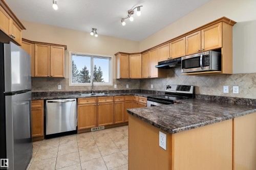 54 Birchglen Crescent, Leduc, AB - Indoor Photo Showing Kitchen With Double Sink