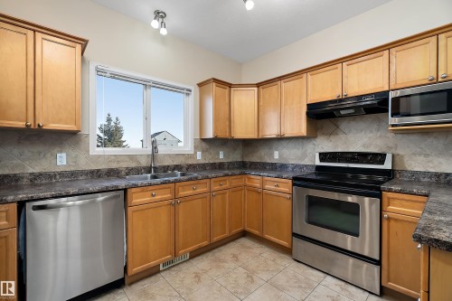 54 Birchglen Crescent, Leduc, AB - Indoor Photo Showing Kitchen With Double Sink