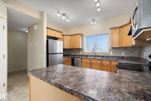 54 Birchglen Crescent, Leduc, AB - Indoor Photo Showing Kitchen With Double Sink