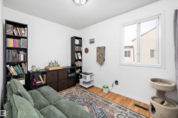 Sitting room featuring a textured ceiling and light wood-style floors - 