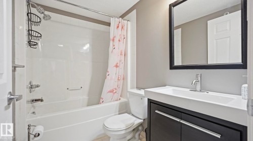 Full bath with vanity and shower / bath combo - 401 636 Mcallister Loop, Edmonton, AB - Indoor Photo Showing Bathroom