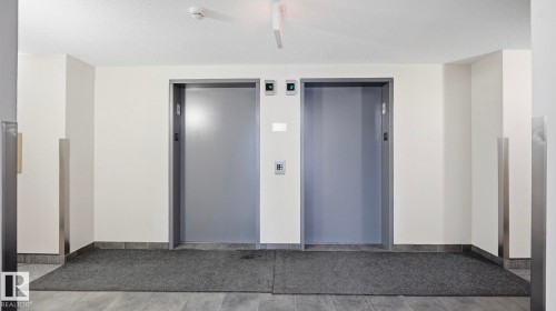 View of exterior entry featuring elevator - 401 636 Mcallister Loop, Edmonton, AB - Indoor Photo Showing Other Room