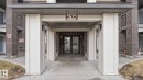 Entrance to property with brick siding and french doors - 401 636 Mcallister Loop, Edmonton, AB  - Outdoor With Exterior 