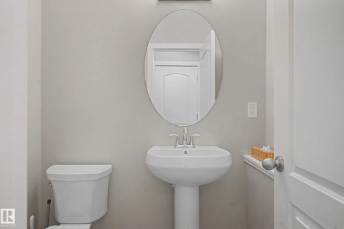 Bathroom featuring toilet and a sink - 2577 Coughlan Road, Edmonton, AB - Indoor Photo Showing Bathroom
