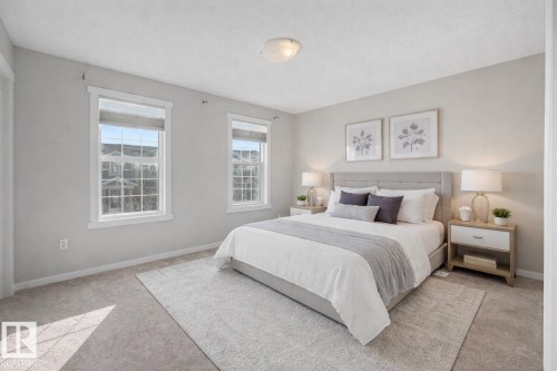 Bedroom with light carpet and baseboards - 2577 Coughlan Road, Edmonton, AB - Indoor Photo Showing Bedroom