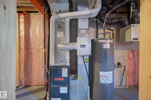Utilities featuring water heater and heating unit - 2577 Coughlan Road, Edmonton, AB - Indoor Photo Showing Basement