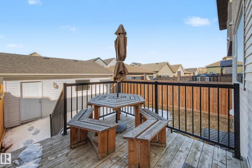Deck featuring a residential view and outdoor dining area - 2577 Coughlan Road, Edmonton, AB - Outdoor With Exterior