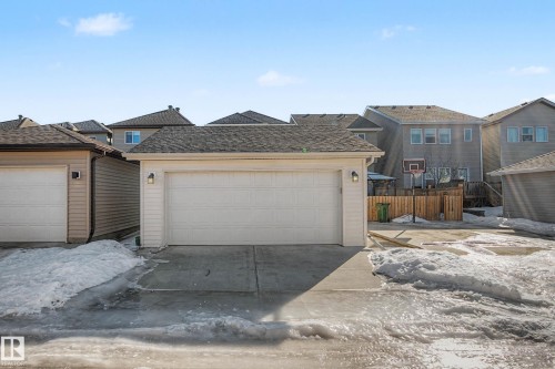 Traditional-style home featuring a garage and a shingled roof - 2577 Coughlan Road, Edmonton, AB - Outdoor