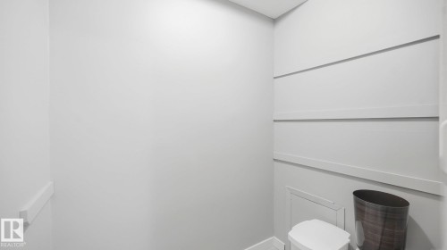 Bathroom featuring toilet and baseboards - 103 1624 48 Street, Edmonton, AB - Indoor