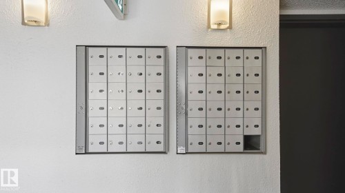 Detailed view of mail area and stucco siding - 103 1624 48 Street, Edmonton, AB -  Photo Showing Other Room