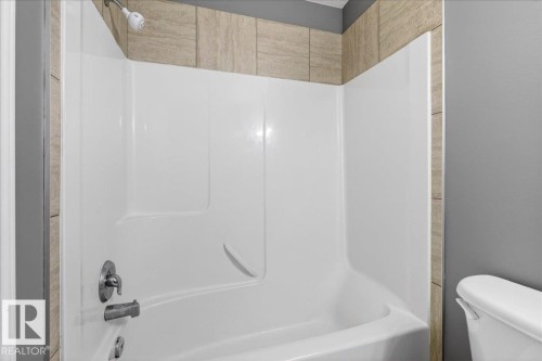 Full bath featuring shower / tub combination and toilet - 150 Acacia Circle, Leduc, AB - Indoor Photo Showing Bathroom