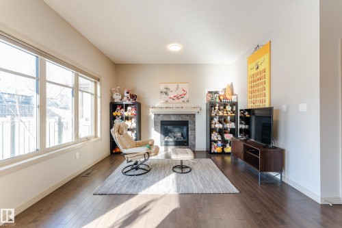 1945 Ainslie Link, Edmonton, AB - Indoor Photo Showing Living Room With Fireplace